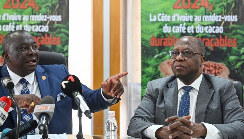 Ivorian minister of agriculture Kobenan Kouassi Adjoumani (left) and Yves Brahima Koné, director general of the Conseil Café-Cacao, in Abidjan, 2 April 2024.