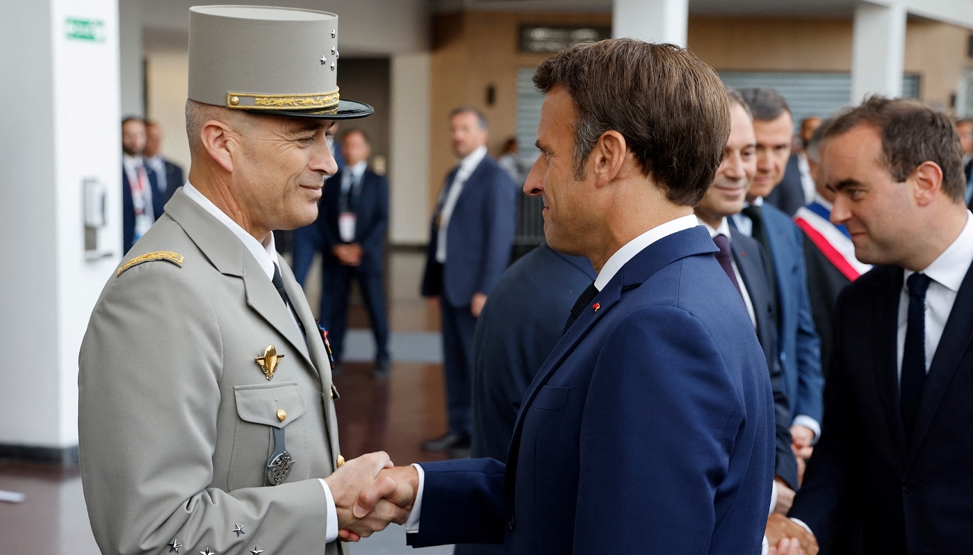 French President Emmanuel Macron with France's Chief of the Defence Staff Thierry Burkhard, in Villepinte, north of Paris, on 13 June 2022.