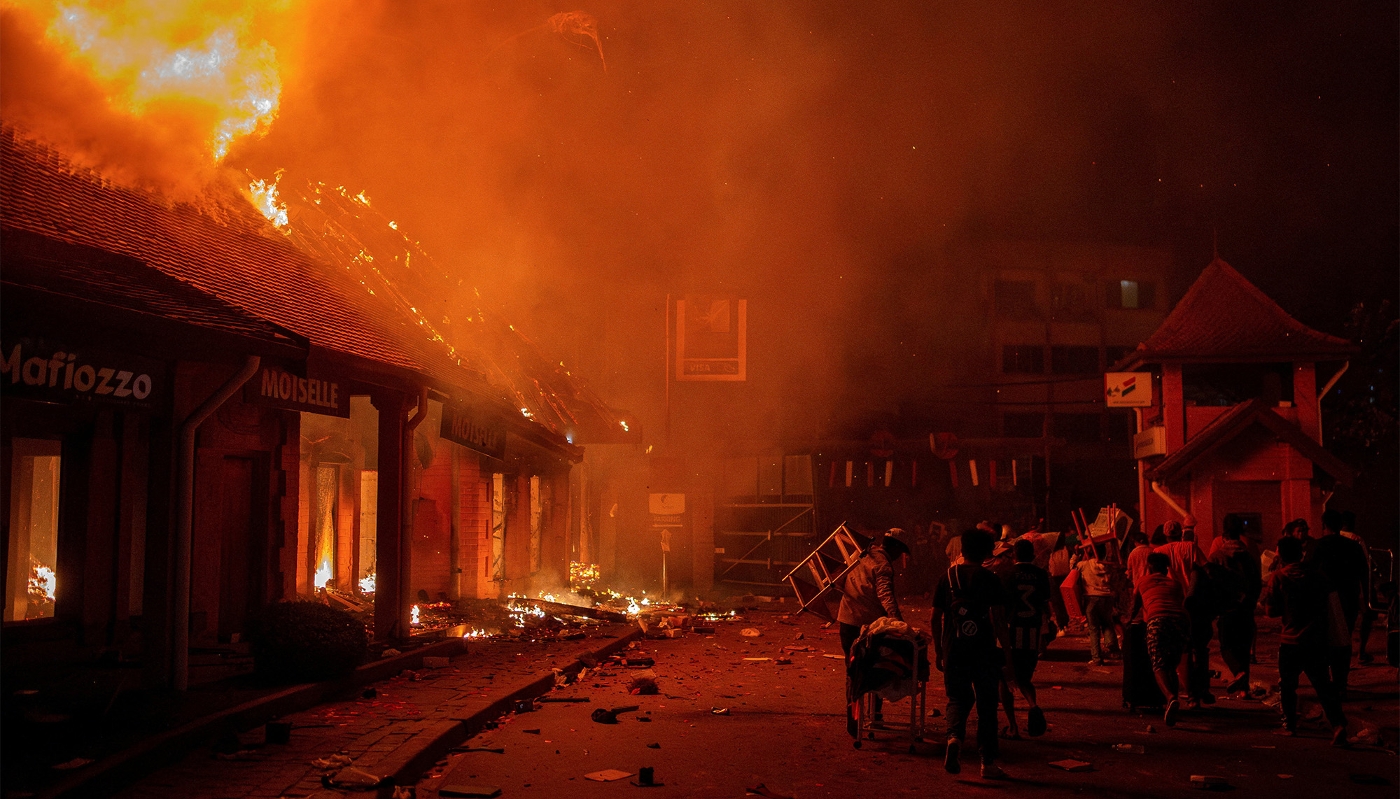 Burning shops during a demonstration in Antananarivo on 25 September 2025.