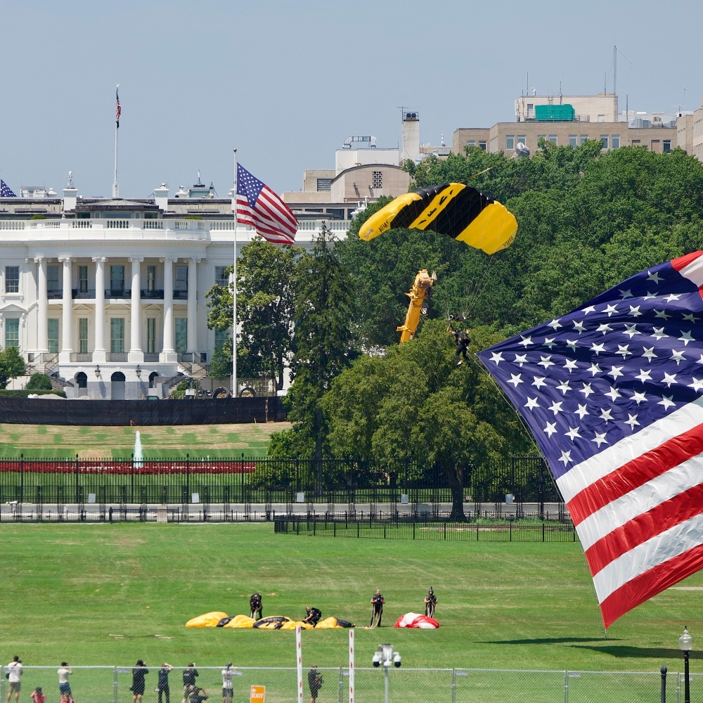 Members of the US Army land with a giant US flag near the White House in Washington, 4 July 2026.