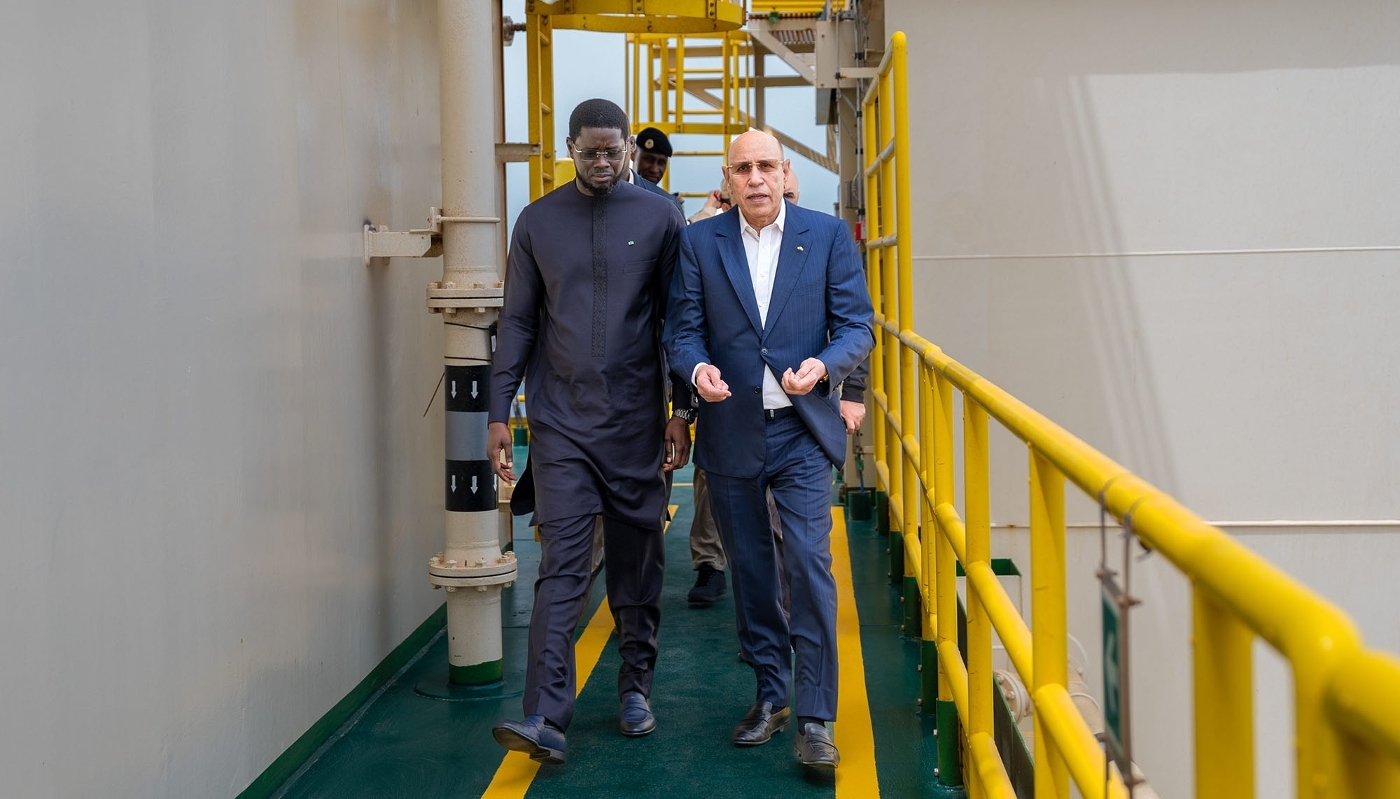 Mauritania's President Mohamed Ould Ghazouani (R) and Senegal’s President Bassirou Diomaye Faye visiting Grand Tortue Ahmeyim gas project near Saint Louis, Senegal, 22 May 2025.