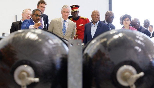 King Philippe of Belgium and the then Namibian President Nangolo Mbumba, with officials, at the Walvis Bay site in Namibia on 2 May 2024.