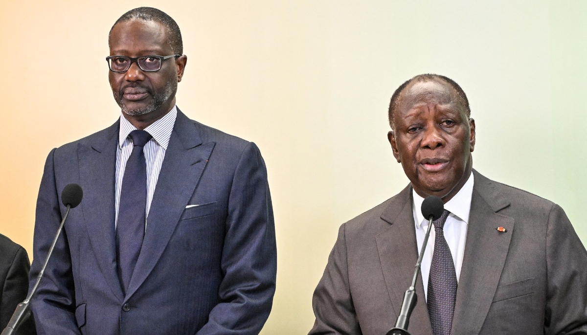 Tidjane Thiam (left), president of the Parti Démocratique de Côte d'Ivoire (PDCI), with Ivorian President Alassane Ouattara in Abidjan, 11 March 2024.