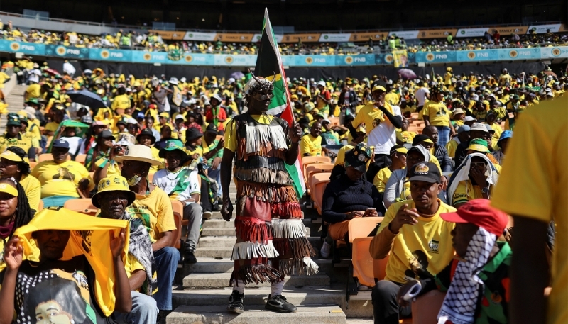 ANC supporter waves South African flag in Johannesburg on 25 May 2024.