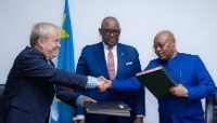 Teit Ritzau, CEO of Adex Platform, Louis Watum, the Congolese minister of mines, and Godard Motemona Gibolum, director-general of FOMIN, at the signing of an agreement aimed at reviving the cutting, polishing and trading of Congolese artisanal diamonds, in Kinshasa, on 29 June 2026.