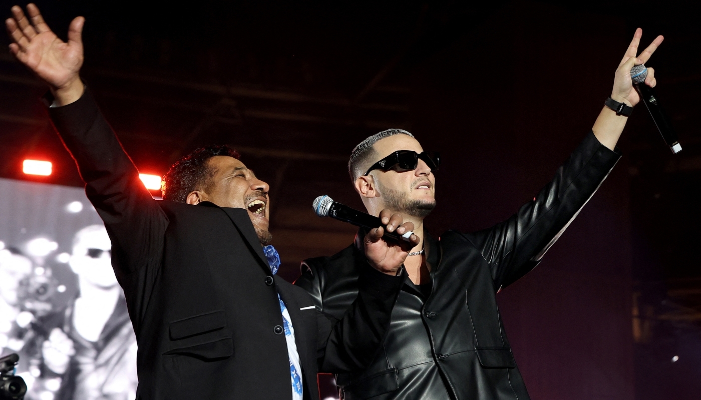 Algerian singer Cheb Khaled and Franco-Algerian DJ Snake in Doha, in December 2022.