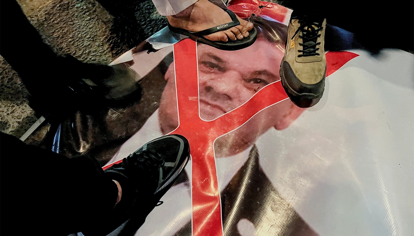 Demonstrators put their feet on a photo of Libya's head of Government of National Unity, Abdelhamid Dabaiba, in Misrata, 19 March 2024.