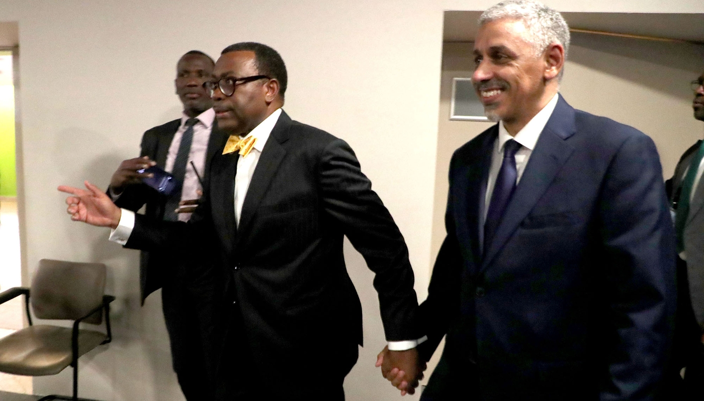 Outgoing President Akinwumi Ayodeji Adesina (C) accompanies Sidi Ould Tah (R) during the AfDB annual meeting in Abidjan, 30 May 2025.