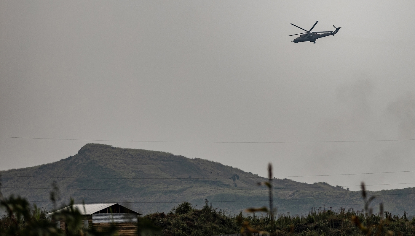 A helicopter belonging to the DRC's armed forces flies over Sake, in North Kivu, DRC, in January 2025.