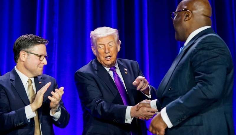 Félix Tshisekedi shakes hands with Donald Trump under the watchful eye of Mike Johnson, speaker of the House of Representatives, at the National Prayer Breakfast in Washington on 5 February 2026.