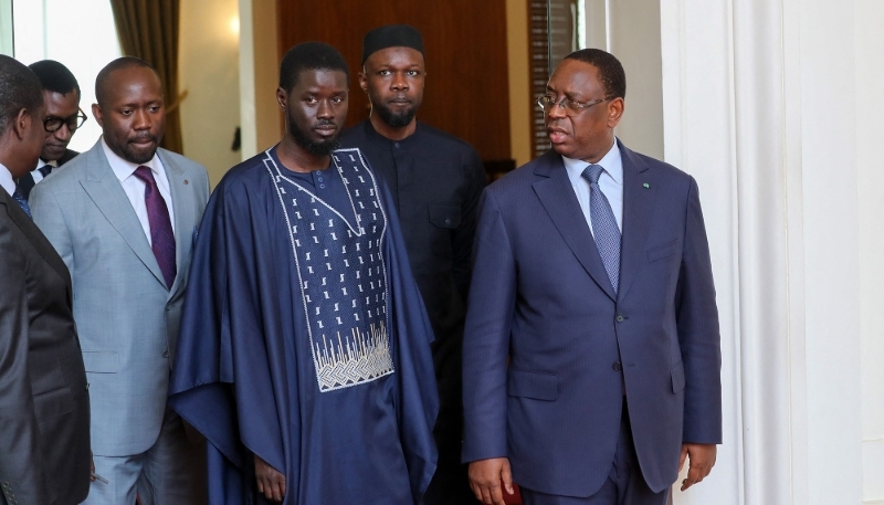 Bassirou Diomaye Faye and incumbent President Macky Sall (r.), followed by Ousmane Sonko, at the Palace of the Republic, Dakar, 28 March 2024.