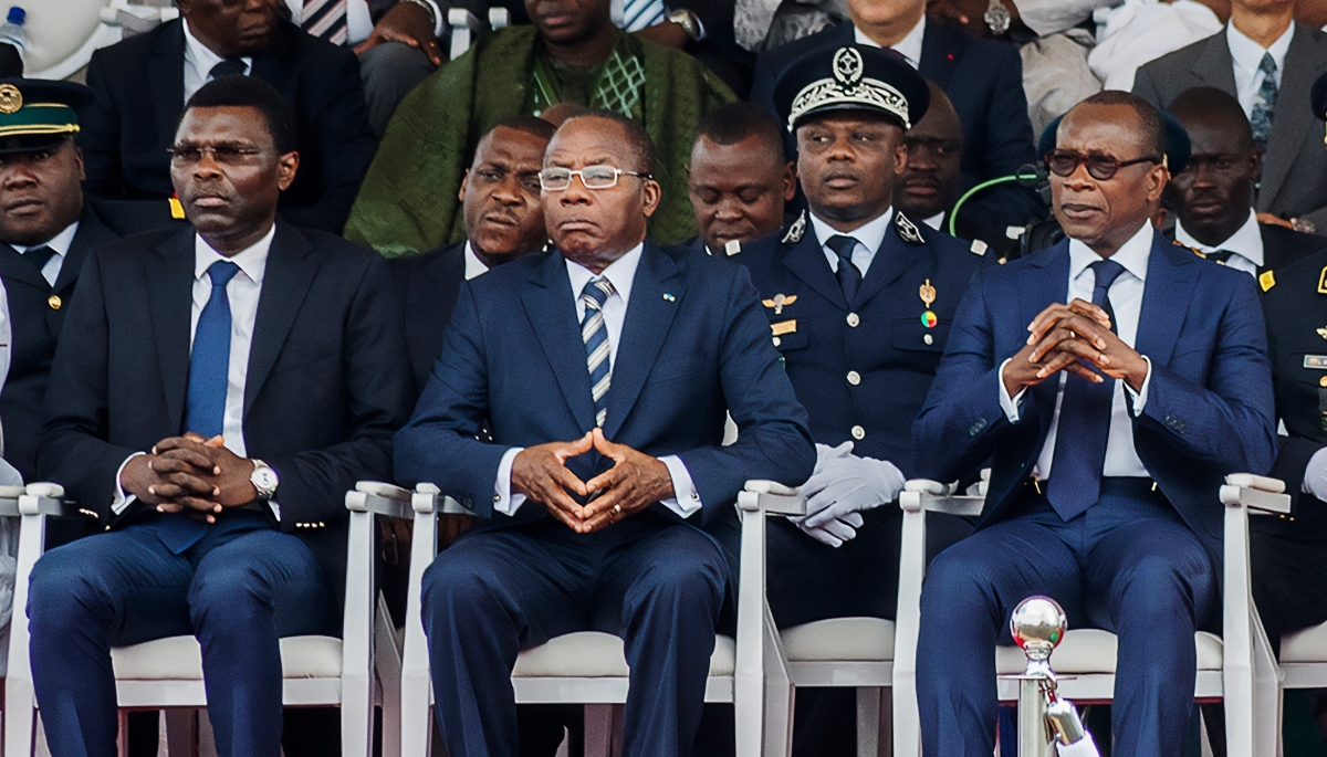 Joseph Djogbenou (left), former President of the Beninese Constitutional Court, and President Patrice Talon (far right), in Cotonou, August 2018.