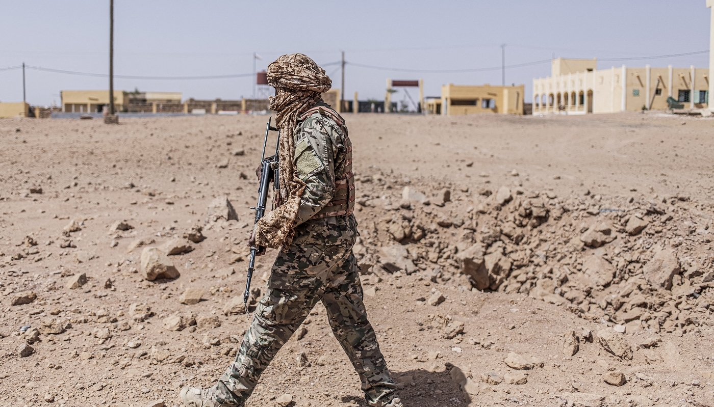 An FLA fighter inspects the area following a FAMa air strike in Kidal, Mali, on 14 May 2026.