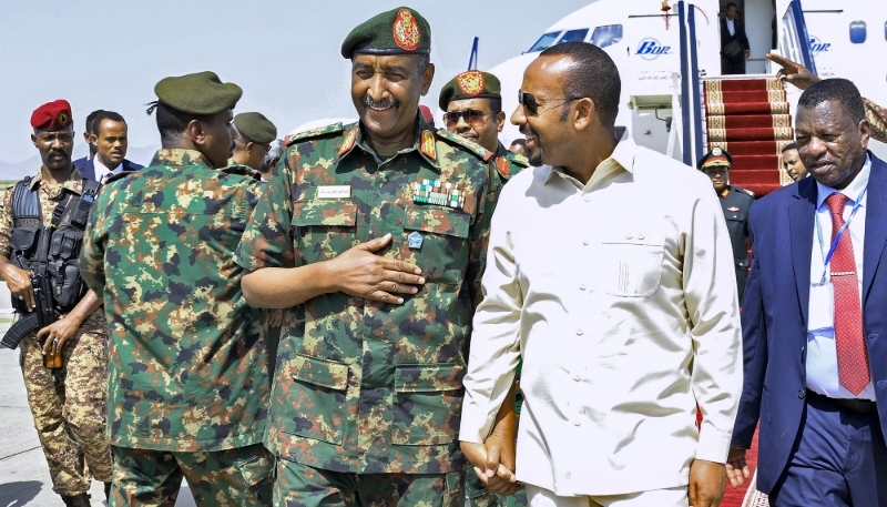 General Abdel Fattah al-Burhan greets Ethiopian Prime Minister Abiy Ahmed at Port Sudan International Airport on 9 July 2024.