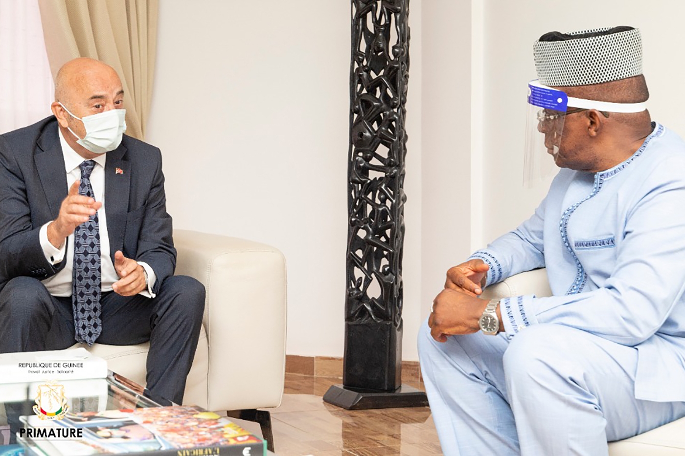 Turkish Ambassador to Guinea Volkan Türk Vural (left) during a meeting with Guinean Prime Minister Ibrahima Kassory Fofana on 21 April 2021.