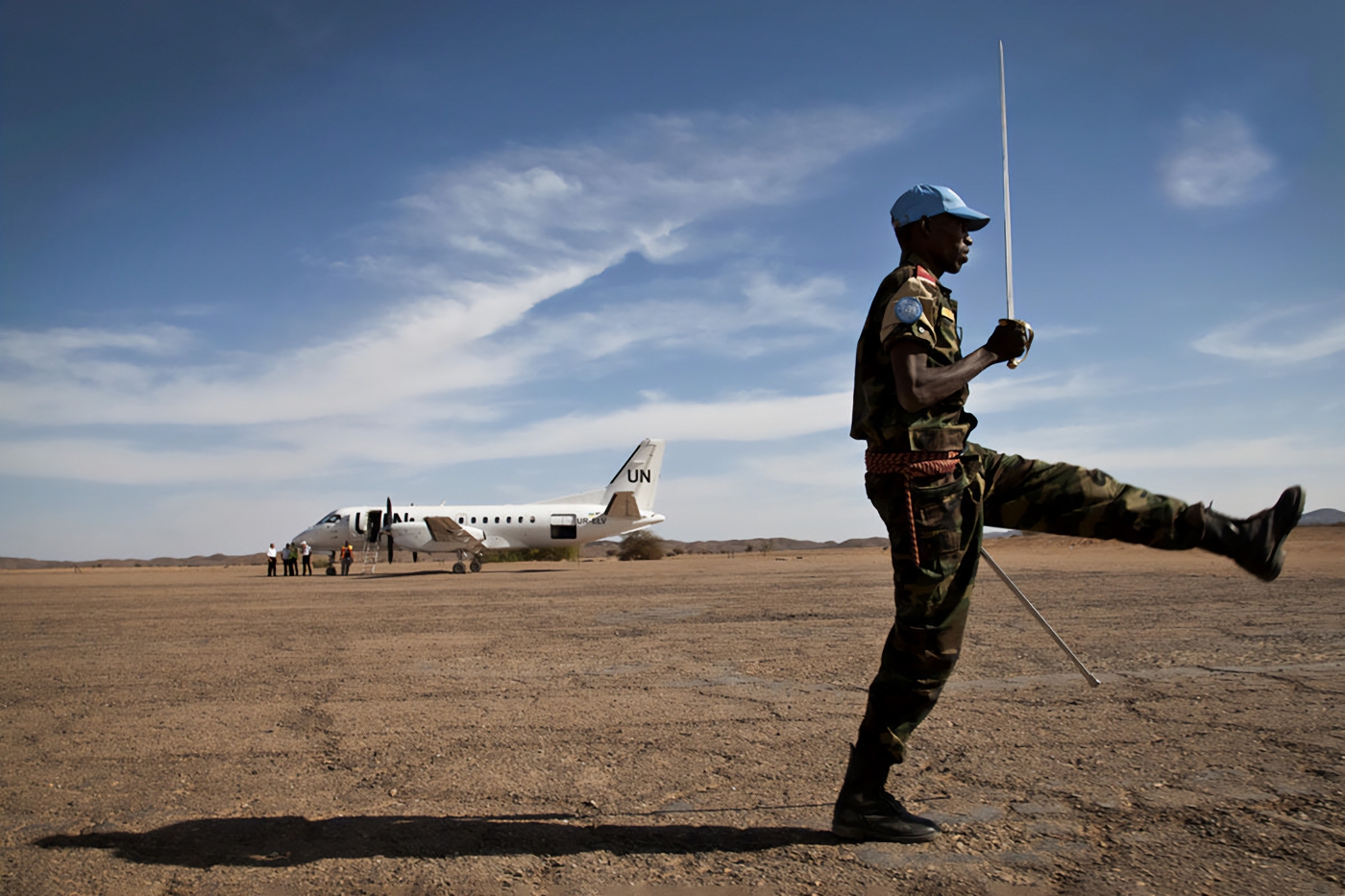 A Chadian MINUSMA soldier parades during a visit by Under-Secretary-General for Peacekeeping Operations Hervé Ladsous to Tessalit, Mali, in March 2013.