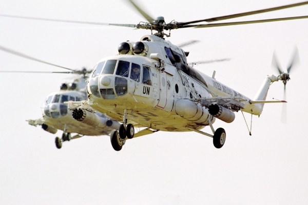 Mil Mi-8 helicopters with partially painted-out UN logos.