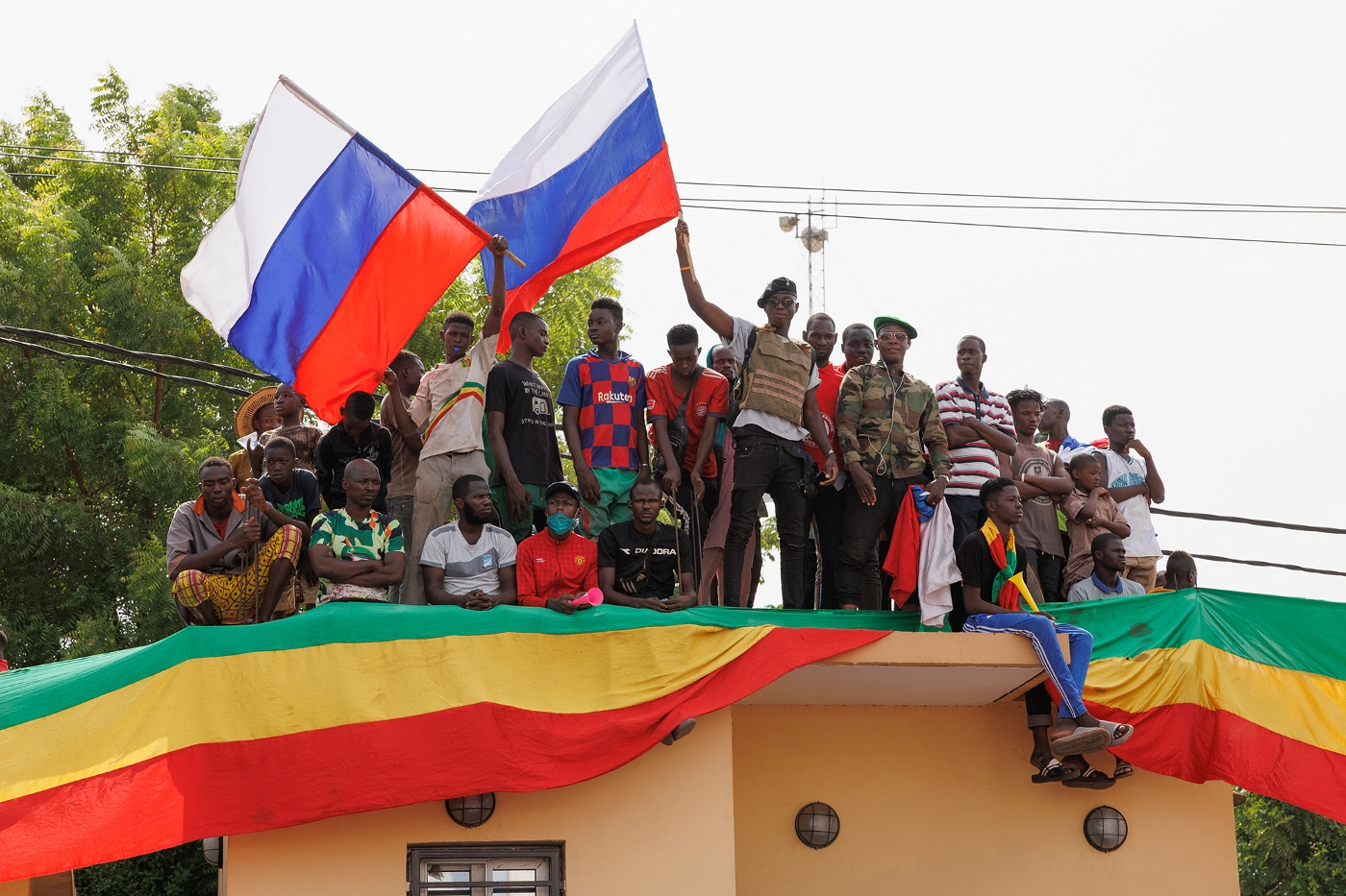 Supporters of the Malian Interim President wave Russian flags during a pro-Junta and pro-Russia rally in Bamako on May 13, 2022.