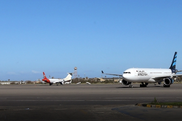 Grounded aircrafts sit on the tarmac at Mitiga International Airport in the Libyan capital Tripoli on 8 April 2019, where several GardaWorld employees were arrested on 12 April.