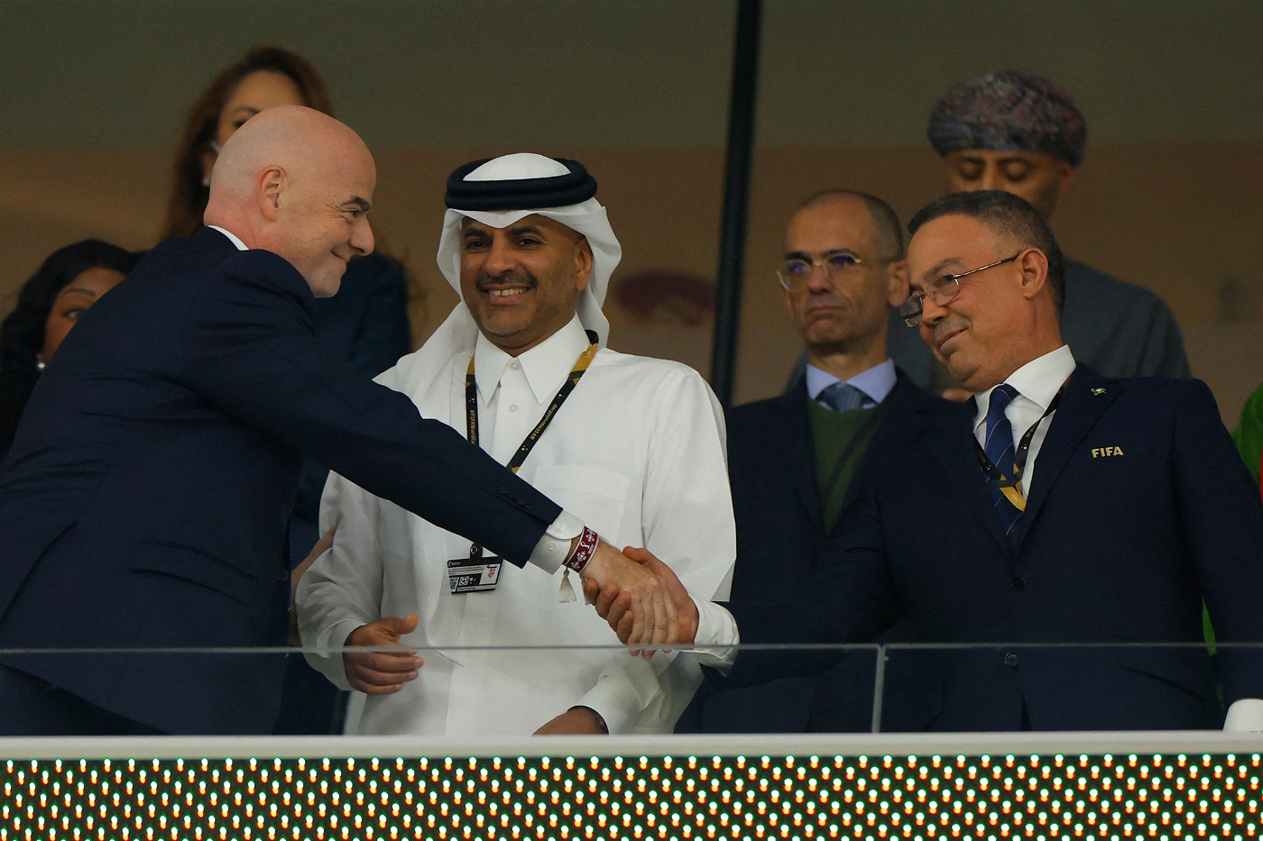 FIFA President Gianni Infantino (L) speaks with Qatar's Prime Minister Khalid bin Khalifa bin Abdulaziz Al Thani (C) and President of Morocco's Royal Football Federation (FRMF) Fouzi Lekjaa (R) prior to the Qatar 2022 World Cup quarter-final football match between Morocco and Portugal at the Al-Thumama Stadium in Doha on 10 December 2022.