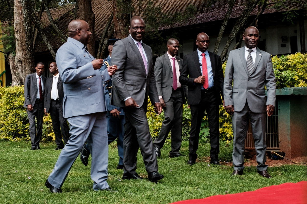 Burundi's president Evariste Ndayishimiye (L) speaks with Kenya's president William Ruto (2nd L) during the opening of the EAC-led Nairobi Process, Nairobi, 28 November 2022.