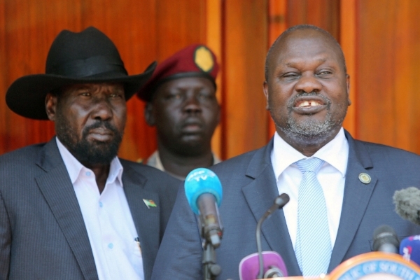 South Sudan's vice president Riek Machar flanked by President Salva Kiir at the State House in Juba, South Sudan, on 20 February 2020.