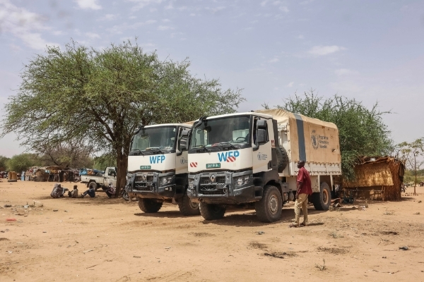 WFP trucks by shelters for Sudanese refugees from the Tandelti area who crossed into Chad, in Koufroun, 30 April 2023.