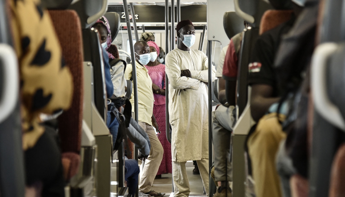 Passengers in a regional express train leaving Dakar train station on 11 January 2022.