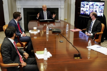 United States President Joseph R. Biden Jr. speaks during the Virtual CEO Summit on Semiconductor and Supply Chain at the White House in Washington, on Monday, April 12, 2021. Seated with Biden, clockwise from bottom left, are Daleep Singh, United States Deputy National Security Advisor for International Economics, Brian Deese, Director, National Economic Council, and US National Security Advisor Jake Sullivan.