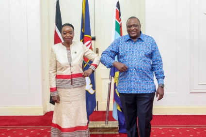 Kenyan defence minister Monica Juma with Kenya's head of state Uhuru Kenyatta.
