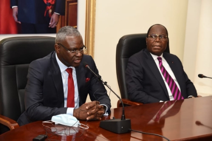 Congolese Prime Minister Anatole Collinet Makosso (left) is still working primarily with the team formed by his predecessor, Clément Mouamba (right).