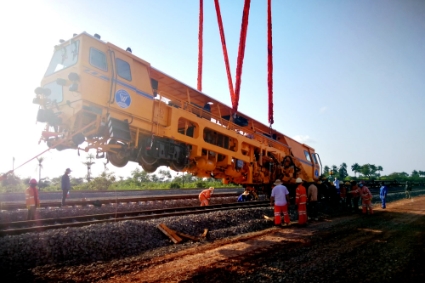 Rolling stock being installed on the Dapilon-Santou railway constructed by Winning Consortium Sandou for transporting bauxite in Guinea.