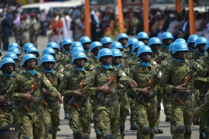 Ivorian soldiers of the UN peacekeeping mission in Mali MINUSMA parade as they take part in the celebrations marking the 59th anniversary of Ivory Coast's independence, on August 7, 2019, in Abidjan.