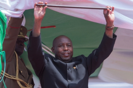 Evariste Ndayishimiye, Burundi's elected President, holds a stick, the symbol of power, during the swearing-in ceremony at Ingoma stadium in Gitega, Burundi, on June 18, 2020.