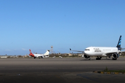 Grounded aircrafts sit on the tarmac at Mitiga International Airport in the Libyan capital Tripoli on 8 April 2019, where several GardaWorld employees were arrested on 12 April.