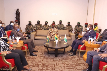 Ghanaian President Nana Akufo-Addo (left) and his Ivorian counterpart Alassane Ouattara (right) meet the putschists during an ECOWAS mission to Guinea on 17 September 2021.
