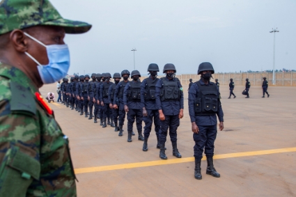 Rwandan army and police personnel wait to board a plane for Mozambique in Kigali on 10 July 2021.