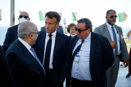 French President Emmanuel Macron (center left) and French historian Benjamin Stora (center right) with Algeria's Foreign Minister Ramtane Lamamra (left) during a visit in Algiers on the 25th of August 2022.