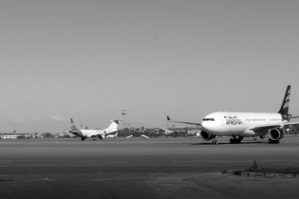 Grounded air-planes sit on the tarmac at Mitiga International Airport in the Libyan capital Tripoli on 8 April 2019.