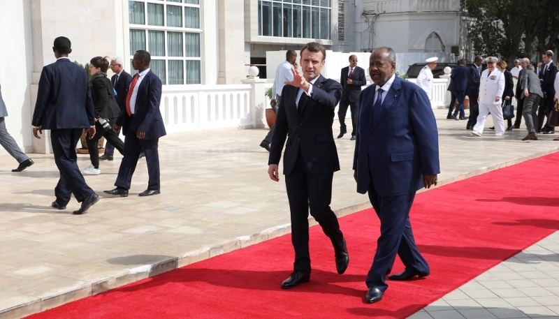 French President Emmanuel Macron and Djibouti President Ismail Omar Guelleh during the official military welcome ceremony at the presidential palace in Djibouti on 12 March 2019.