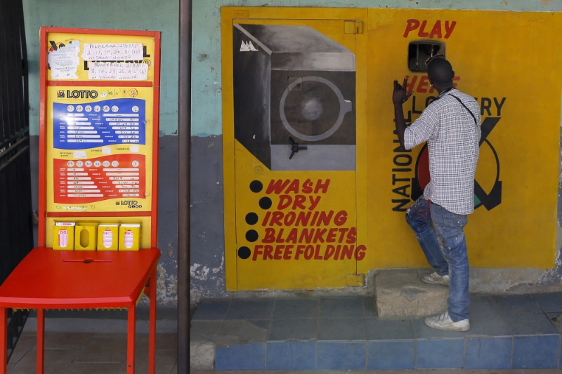 Lottery station with hand-painted advertising adorning the shop in Alexandra Township, Johannesburg.