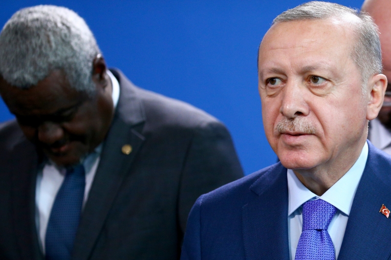 Turkish President Recep Tayyip Erdogan (foreground) and African Union Commission Chairperson Moussa Faki Mahamat (background).