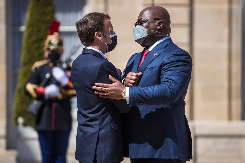 French President Emmanuel Macron greets Democratic Republic of the Congo's President Felix Tshisekedi.