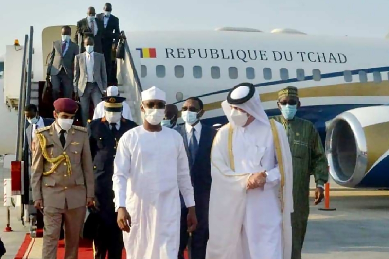 Chad's transitional president Mahamat Idriss Déby (centre) is greeted by Qatar's Emir Tamim bin Hamad al-Thani upon his arrival in Doha on 12 September 2021.