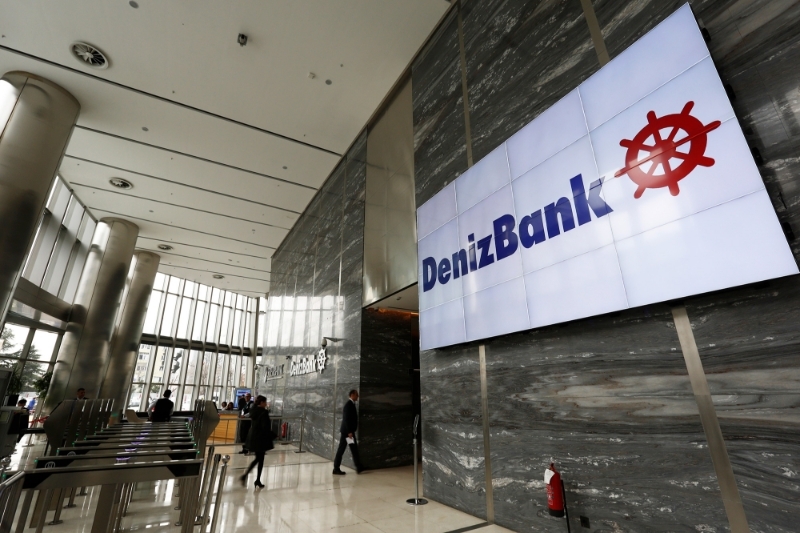 The logo of Denizbank is displayed on a screen at the bank's headquarters in Istanbul, Turkey.