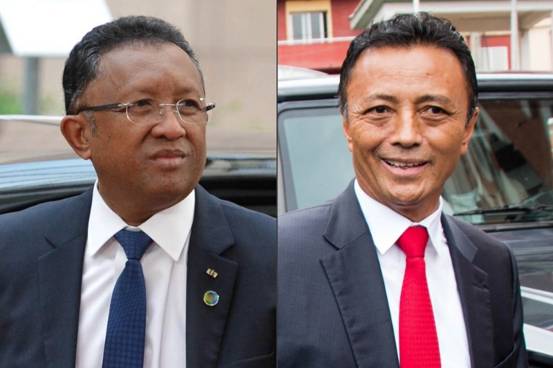 Former Malagasy presidents Hery Rajaonarimampianina and Marc Ravalomanana.