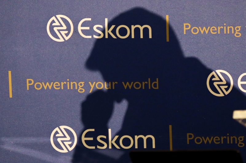 The shadow of the CEO of state-owned power utility Eskom Andre de Ruyter is seen as he speaks at a media briefing in Johannesburg, South Africa, on January 2020.