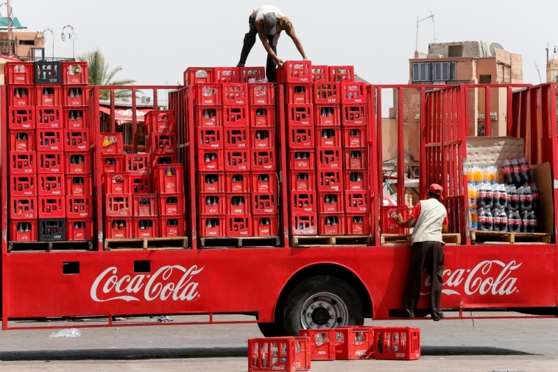 Unloading a cargo of Coca Cola in the Jemaa el-Fna square in Morocco.