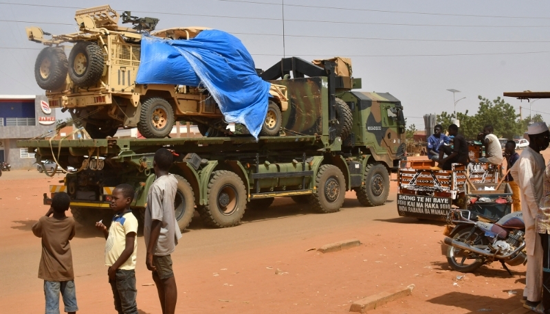 A military truck of the Nigerien security forces, part of an escort to a French Army military convoy crosses the Lazaret district in Niamey on 10 October 2023. 