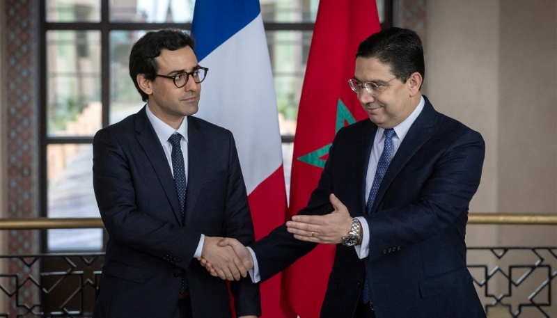 Morocco's FM Nasser Bourita (right) greets his French counterpart Stéphane Séjourné in Rabat, 26 February 2024.